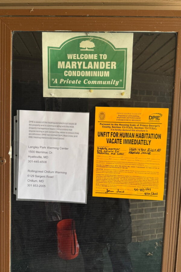 advisory signs posted inside on apartment community message board