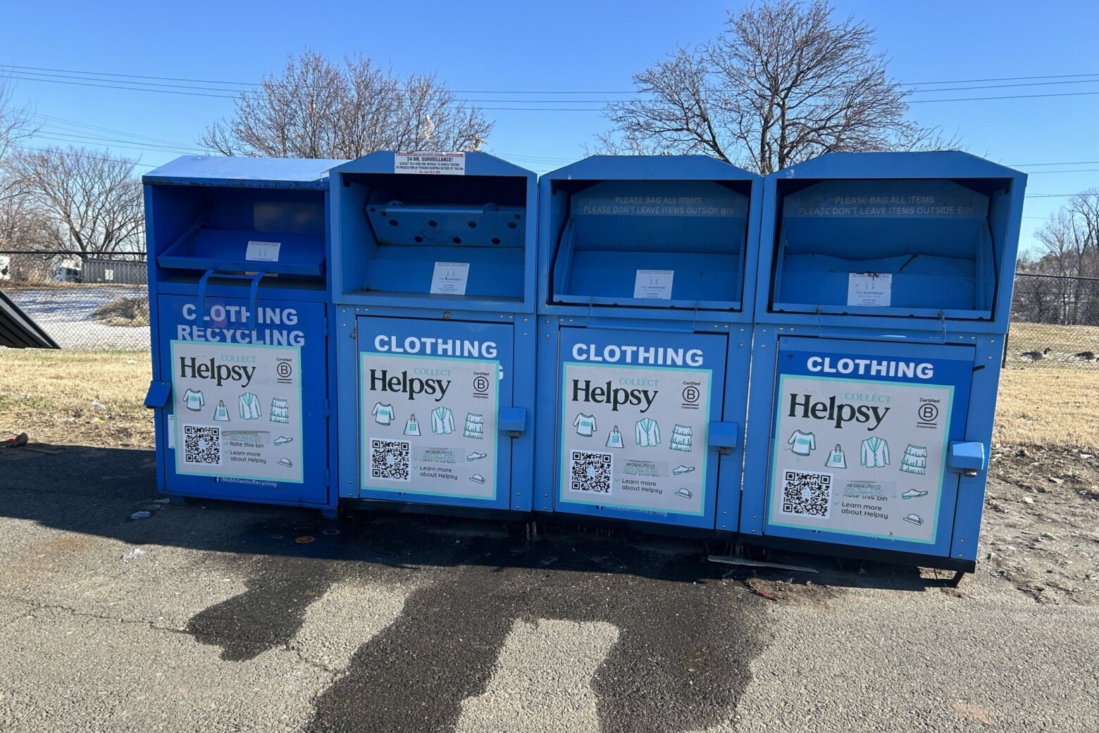 A photo of four blue Helpsy bins in Lorton, Virginia.
