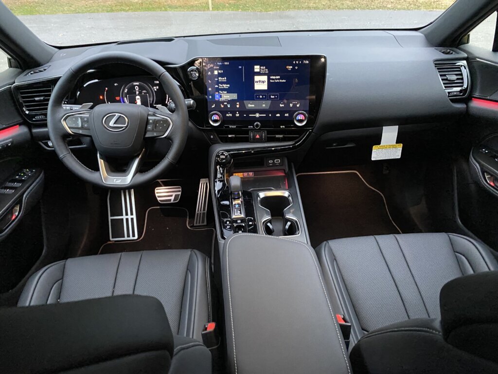 Touches inside include a huge center screen and ambient reddish-purple light.