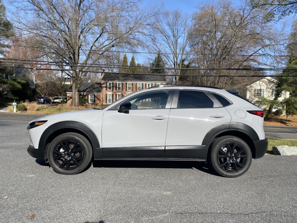 This version of the CX-30 features blacked‑out badges, black roof rails, black mirror caps and black wheels.