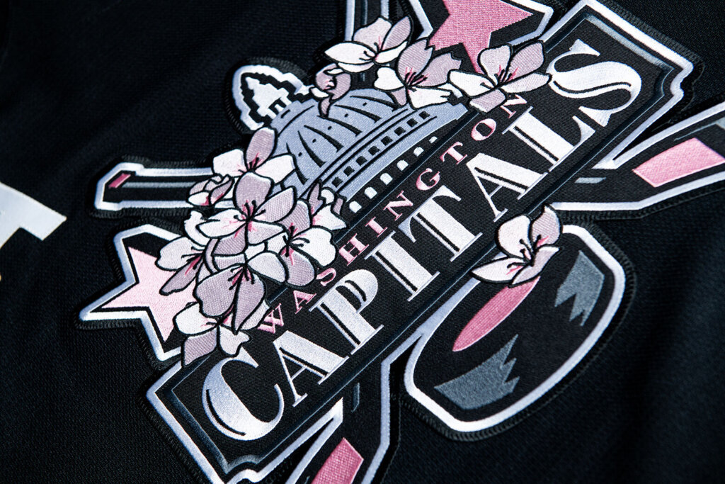The Capitol Dome logo is covered in cherry blossoms as part of the Washington Capitals new jersey for charity.