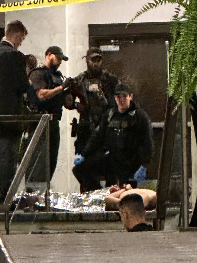 Members of law enforcement control shooting suspect Cole Tomas Allen during the White House Correspondents Dinner, Saturday, April 25, 2026, in Washington. (AP Photo/Alex Brandon)