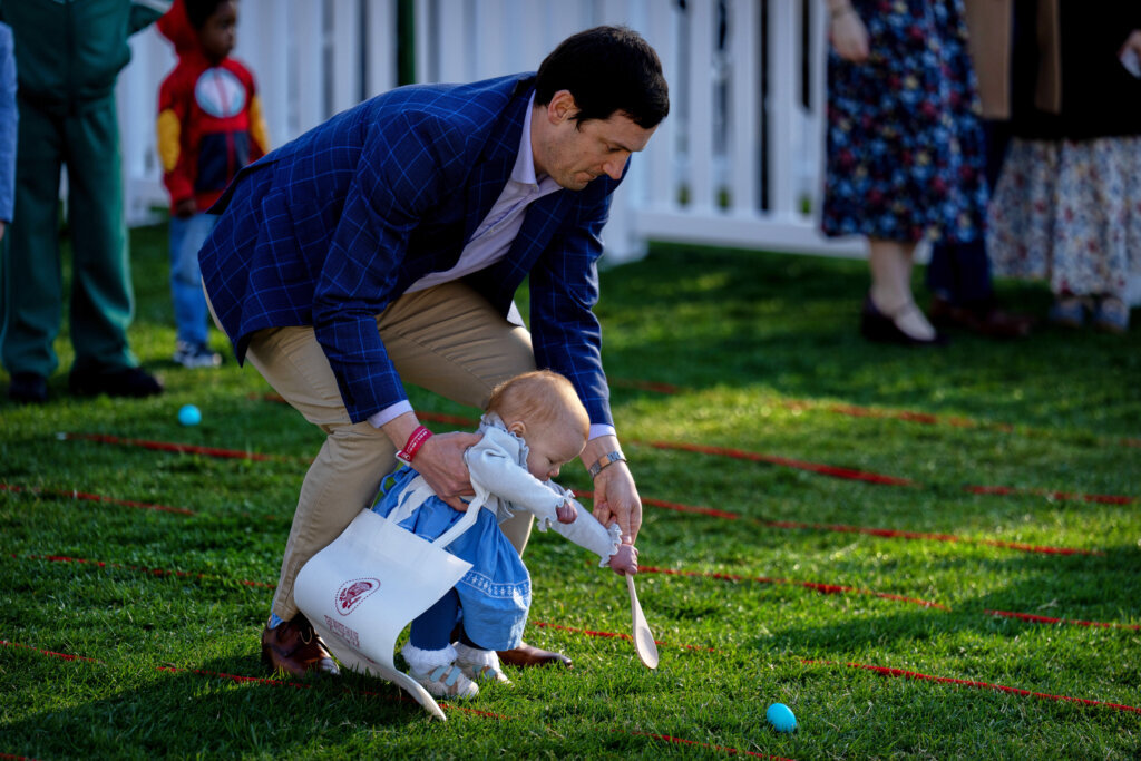 A man and baby participate in the egg roll competition during the White House Easter Egg Roll on the South Lawn of the White House, Monday, April 6, 2026, in D.C. (AP Photo/Mark Schiefelbein)