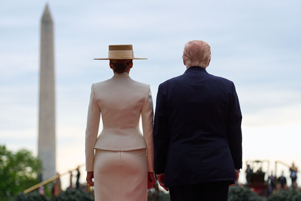 President Donald Trump and first lady Melania Trump wait for the arrival of Britain's King Charles III and Queen Camilla, as seen from the Diplomatic Reception Room, during a State Visit arrival ceremony on the South Lawn of the White House, Tuesday, April 28, 2026, in Washington. (AP Photo/Jacquelyn Martin)