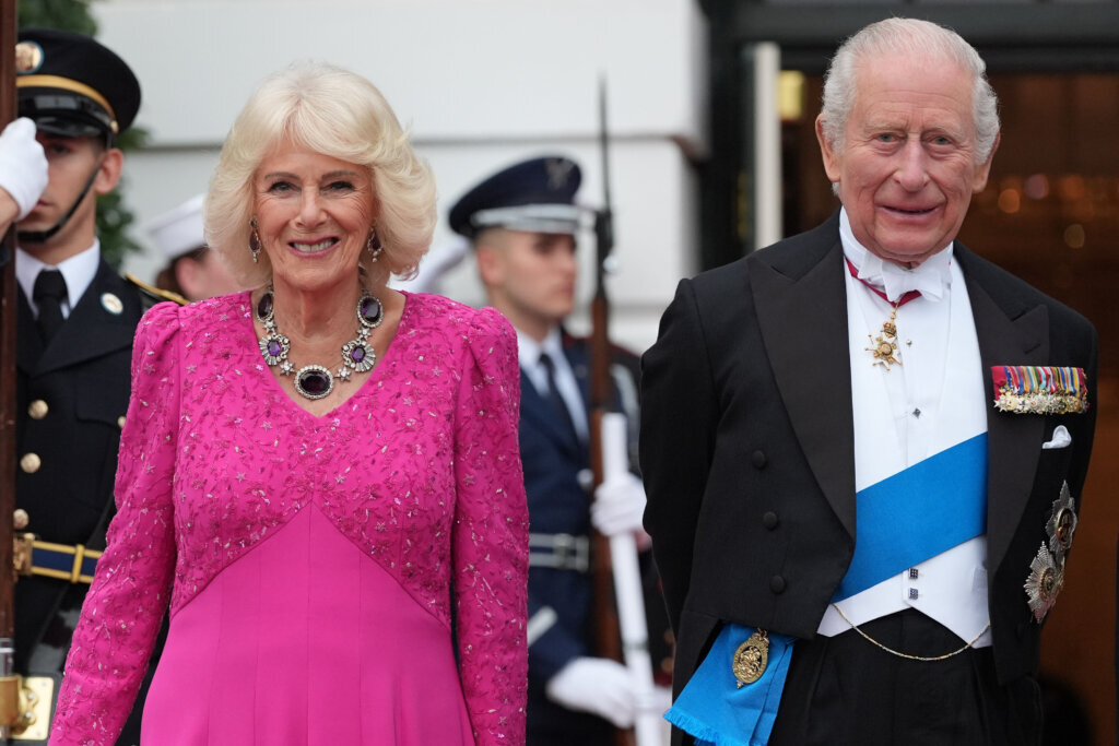 Britain's King Charles III and Queen Camilla stand at the South Portico of the White House as they arrive for a State Dinner Tuesday, April 28, 2026, in Washington. (AP Photo/Alex Brandon)