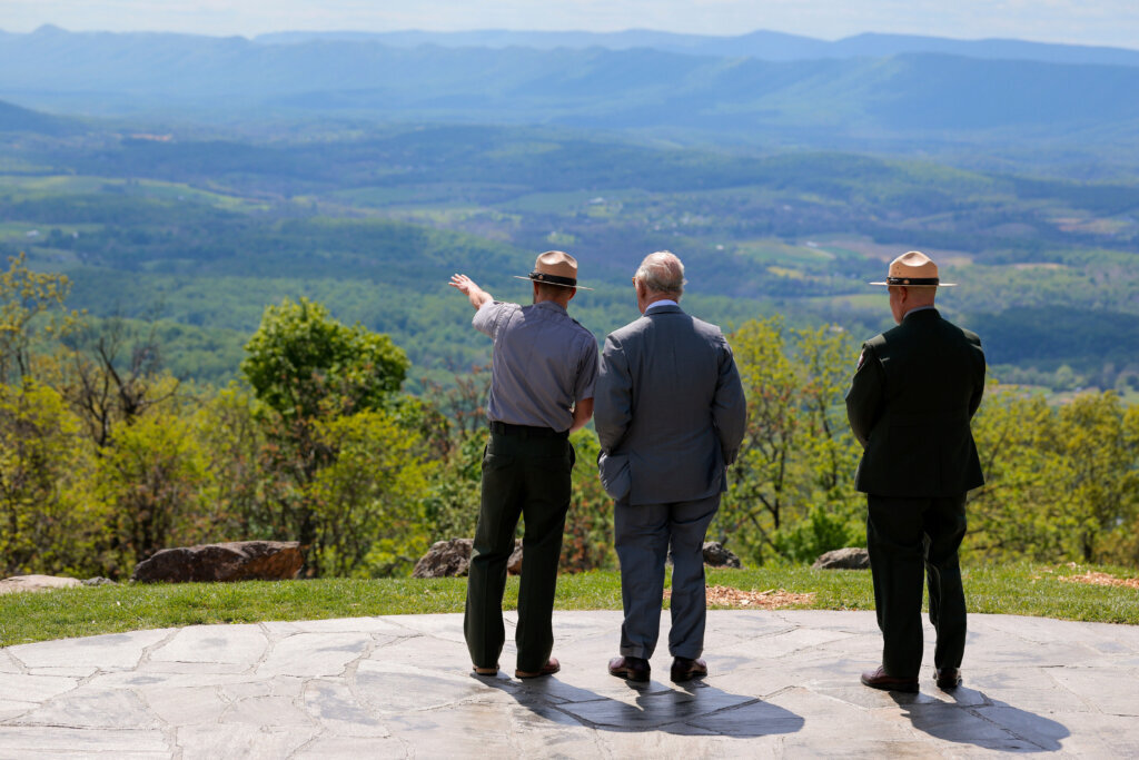 Britain's King Charles III, center, speaks with park officials during a visit to Shenandoah National Park in Front Royal, Virginia, Thursday, April 30, 2026. (Tom Brenner/Pool Photo via AP)