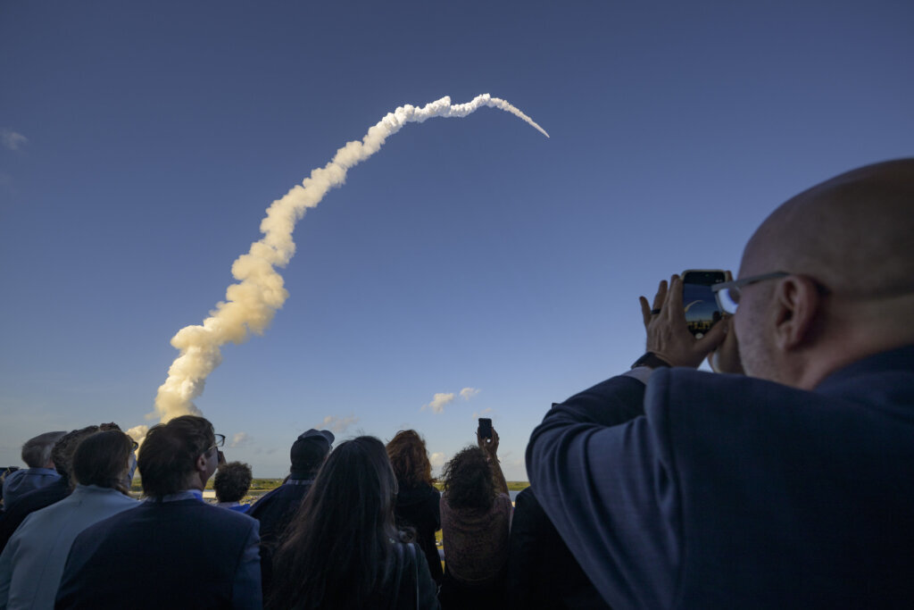 Guests watch the launch of NASA's Space Launch System rocket carrying the Orion spacecraft and four crew members at NASA's Kennedy Space Center in Florida, on Wednesday, April 1, 2026. (Photo by Bill Ingalls/NASA/Getty Images)