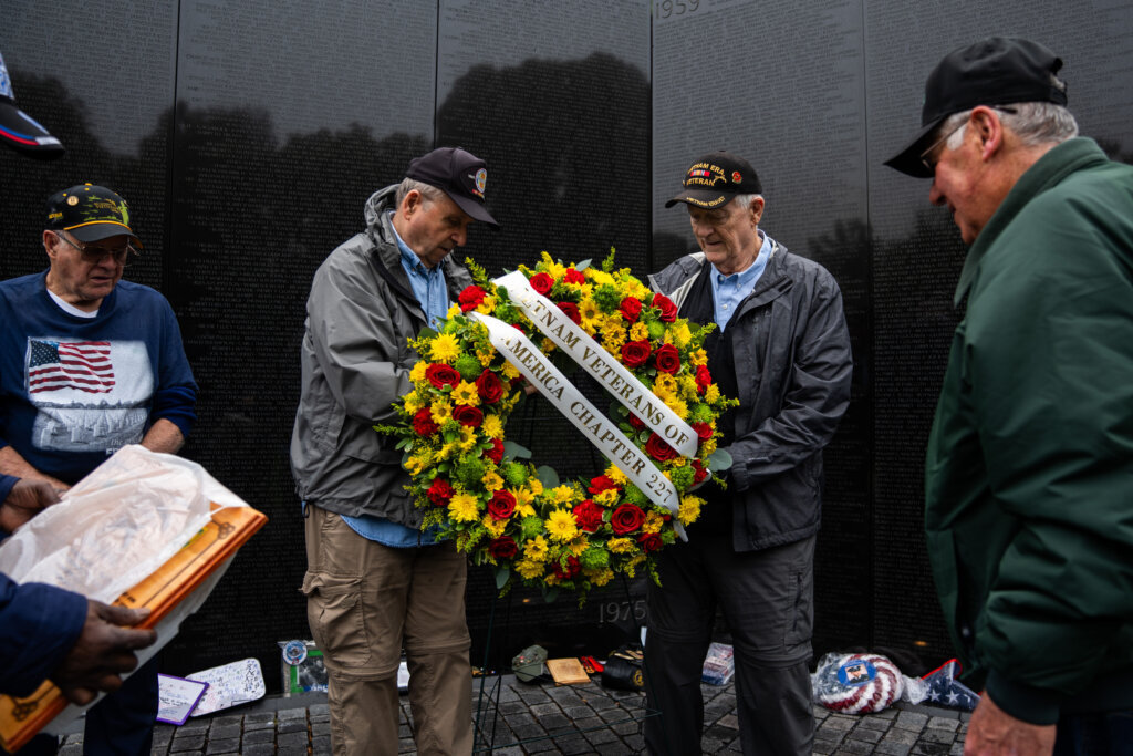A local veterans group pays respects with a commemorative wreath at the Vietnam Veterans Memorial on Memorial Day, Monday, May 25, 2026, in D.C. (AP Photo/Allison Robbert)