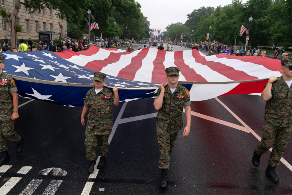 Parade participants march in Washington to commemorate Memorial Day, Monday, May 25, 2026, coinciding with the nation's 250th anniversary celebrations. (AP Photo/Jose Luis Magana)