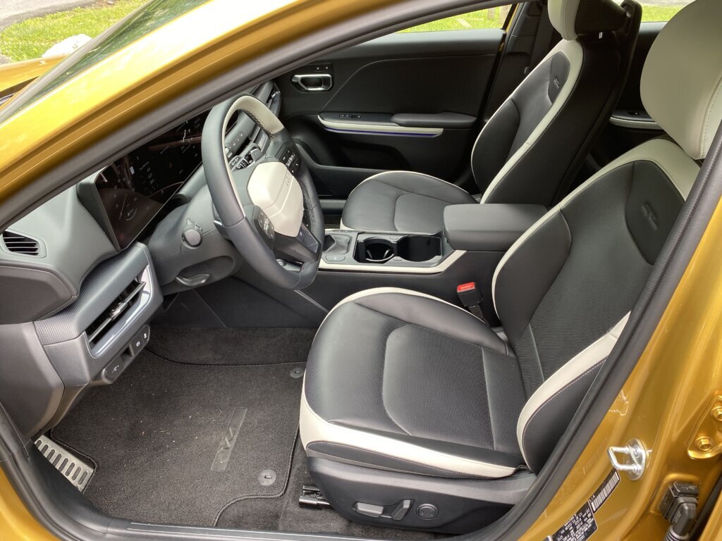 The black-and-white synthetic leather upholstery adds some real visual flair, along with colored ambient lighting strips.